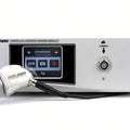 Stryker IS88 AIM camera with advanced imaging modality, featuring a white control unit with a digital display screen and a matching white and silver camera probe with a black cable, shown on a white background.